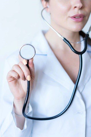 A woman holding a stethoscope in her hand.